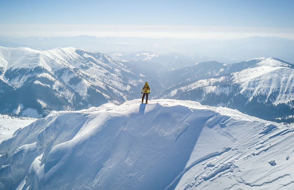Man on top of a mountain